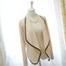 women draped cropped jacket beige black trim cardigan celebrities style