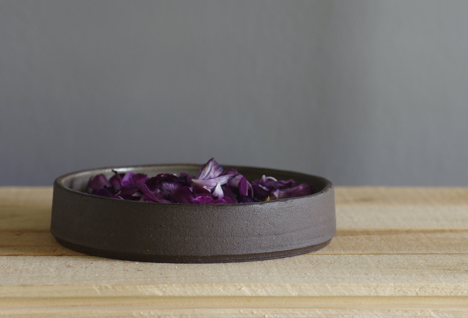 brown stoneware tall plate with grey interior glaze. minimal modern pottery ceramic