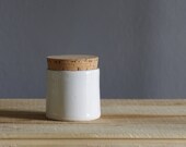 small white corked canister . lidded cup white porcelain .  minimal rustic simple ceramic