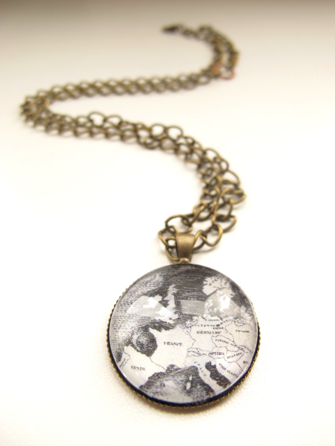 Map of Europe necklace - black and white map of Europe on a brass setting with a brass chain