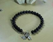 Blue goldstone and kitty riding bike pendant bracelet