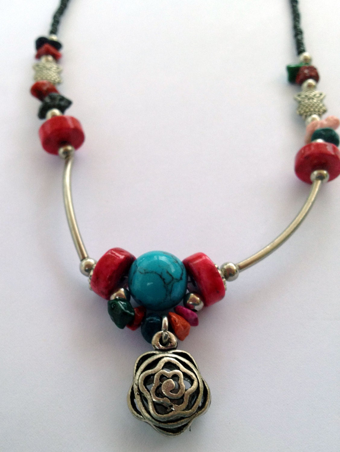 Artisan beaded necklace with colorful gemstones and silver accents