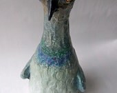 Pigeon sculpture made from champagne bottle and paper mache