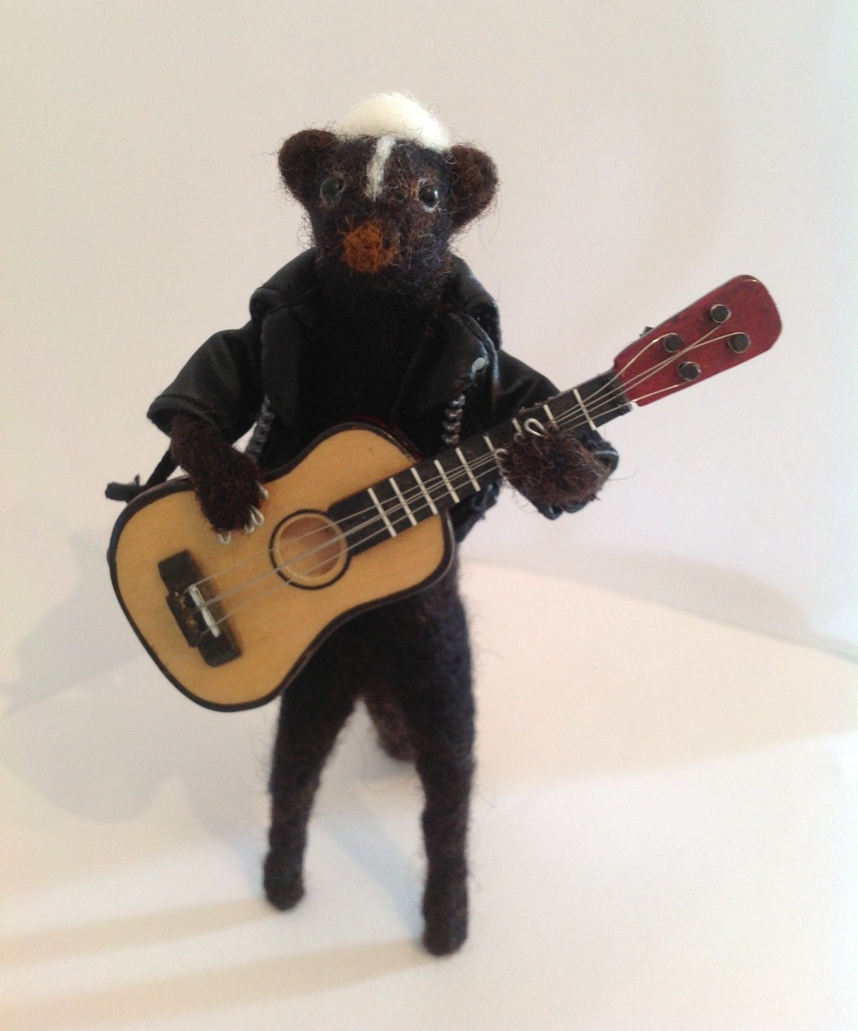 Handmade needle felted Elvis 'Smellvis' Presley skunk guitarist soft sculpture miniature
