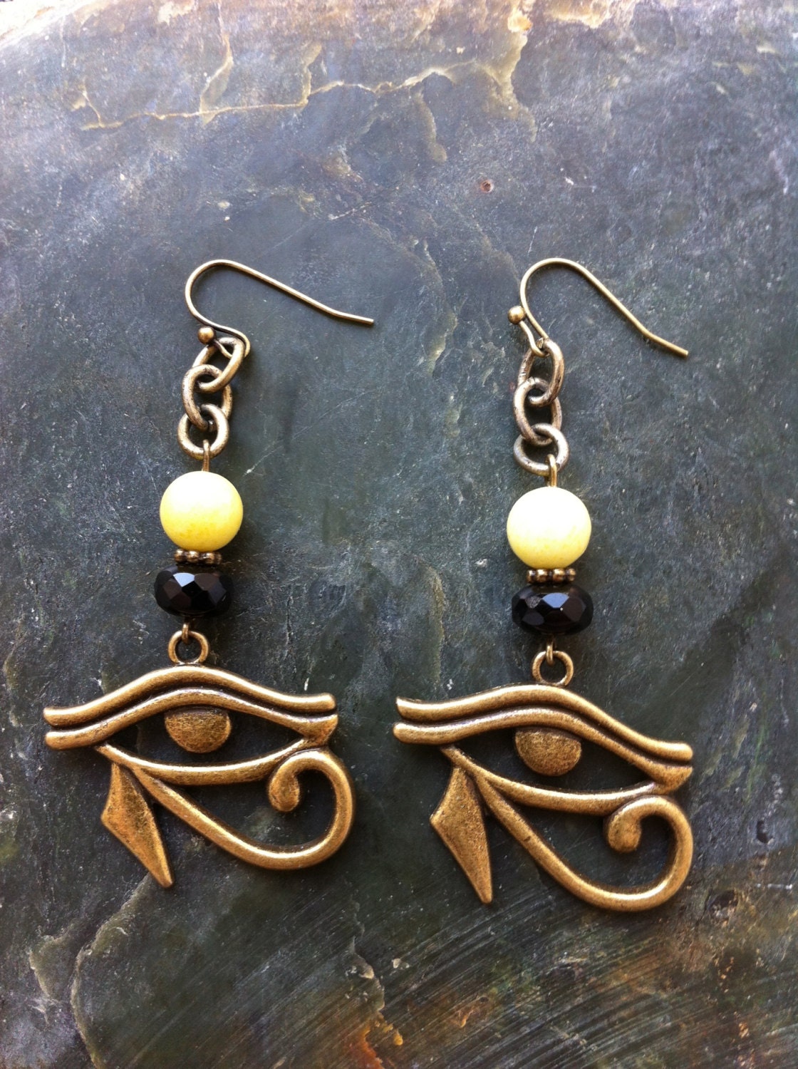 Eye Of Horus Earrings - Antique Bronze Eye Of Ra Charm with Genuine Butter Jade Round Beads and Black Faceted Czech Crystal Rondelles.