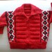 Wool baby cardigan with zipper for 3 to 12 months babies. Red with black and beige quadrangles.