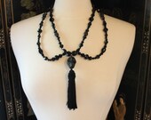 Spiritualist Necklace with Glass Jet Beading, Silk Tassle and Howlite Skulls.