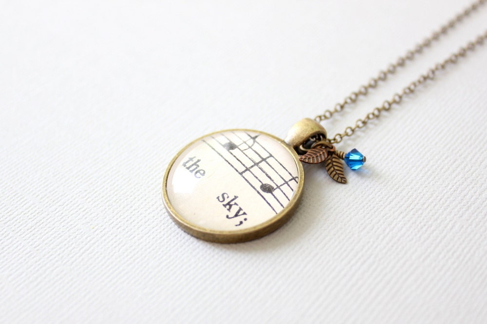 Sky necklace.  Vintage sheet music jewelry.  Unique charm necklace with blue Swarovski crystal and leaves