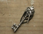 Silver / Gunmetal Plague Key Necklace