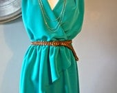Green Pullover Wrap Dress Lined with Shoulder Pleats and Loose Fitting Bodice with Front Over Lay