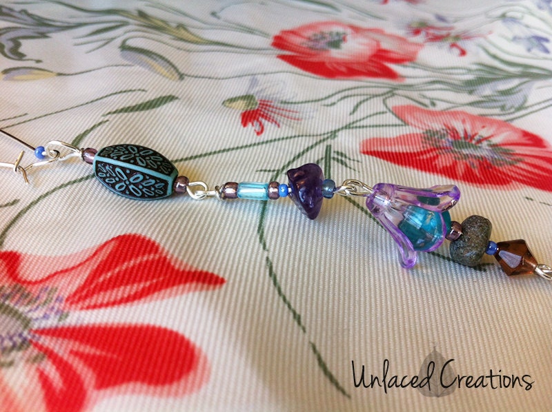tania. a single beaded earring with amethyst charm.
