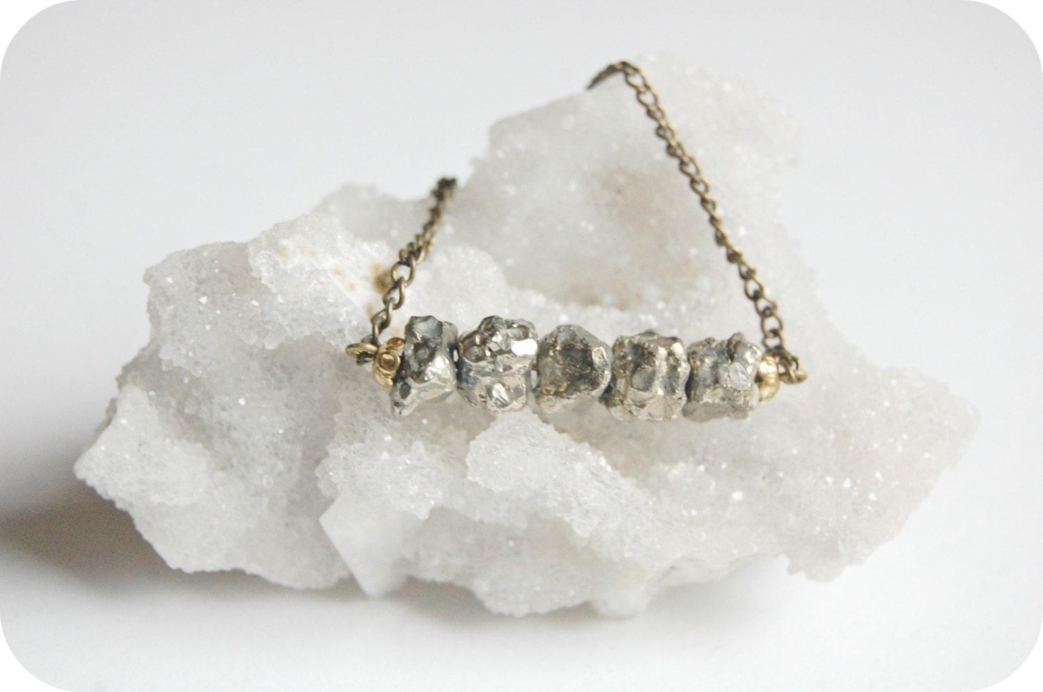 A handful of stars. Raw pyrite necklace with brass chain details.