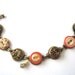 Antique button bracelet, Trendy Tangerine. 1800s buttons, intricate glass buttons