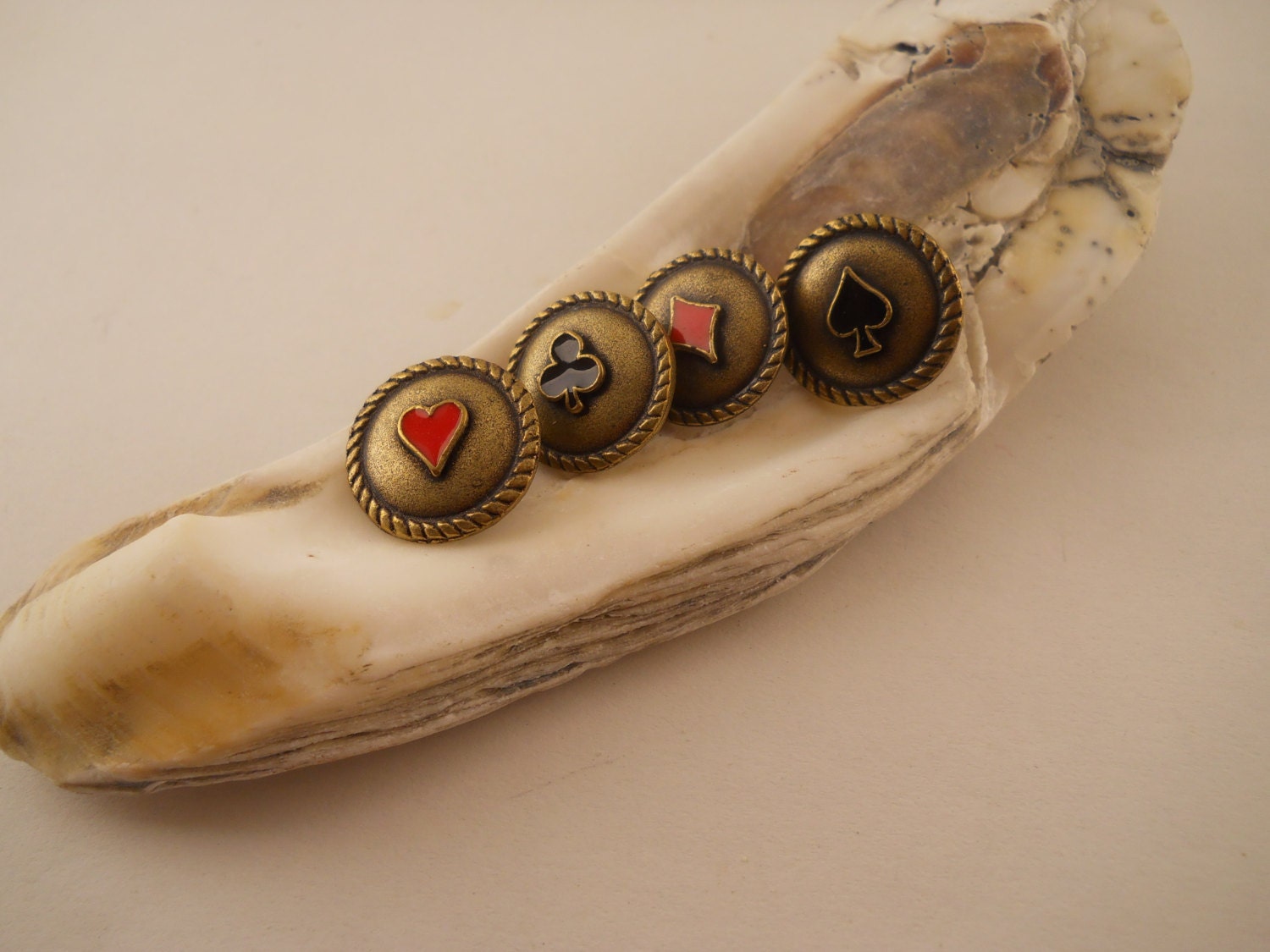 Playing card buttons.  4 buttons, one of each suit.  5/8 inch.  Heart.  Spade.  Diamond.  Club.