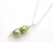 Peapod necklace. Two peas in a pod, green pearl pendant on sterling silver chain.