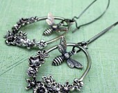 Chasing Flowers: antiqued silver and gunmetal floral elongated hoop and honey bee earrings