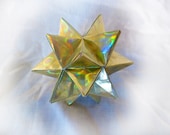Golden shiny Origami star- Geometric origami made of golden sparkly paper