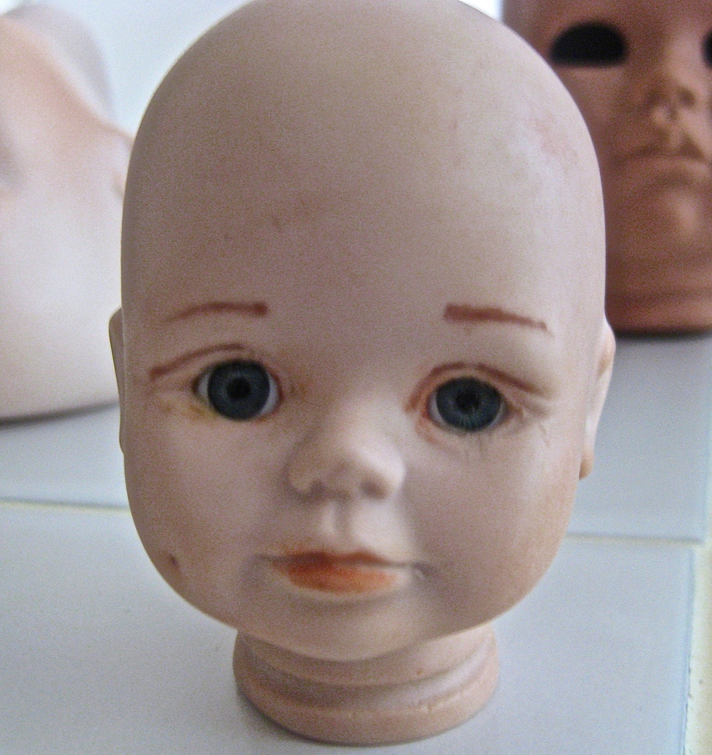 Bisque doll head supply   made in USA child number DH22  glass eyes