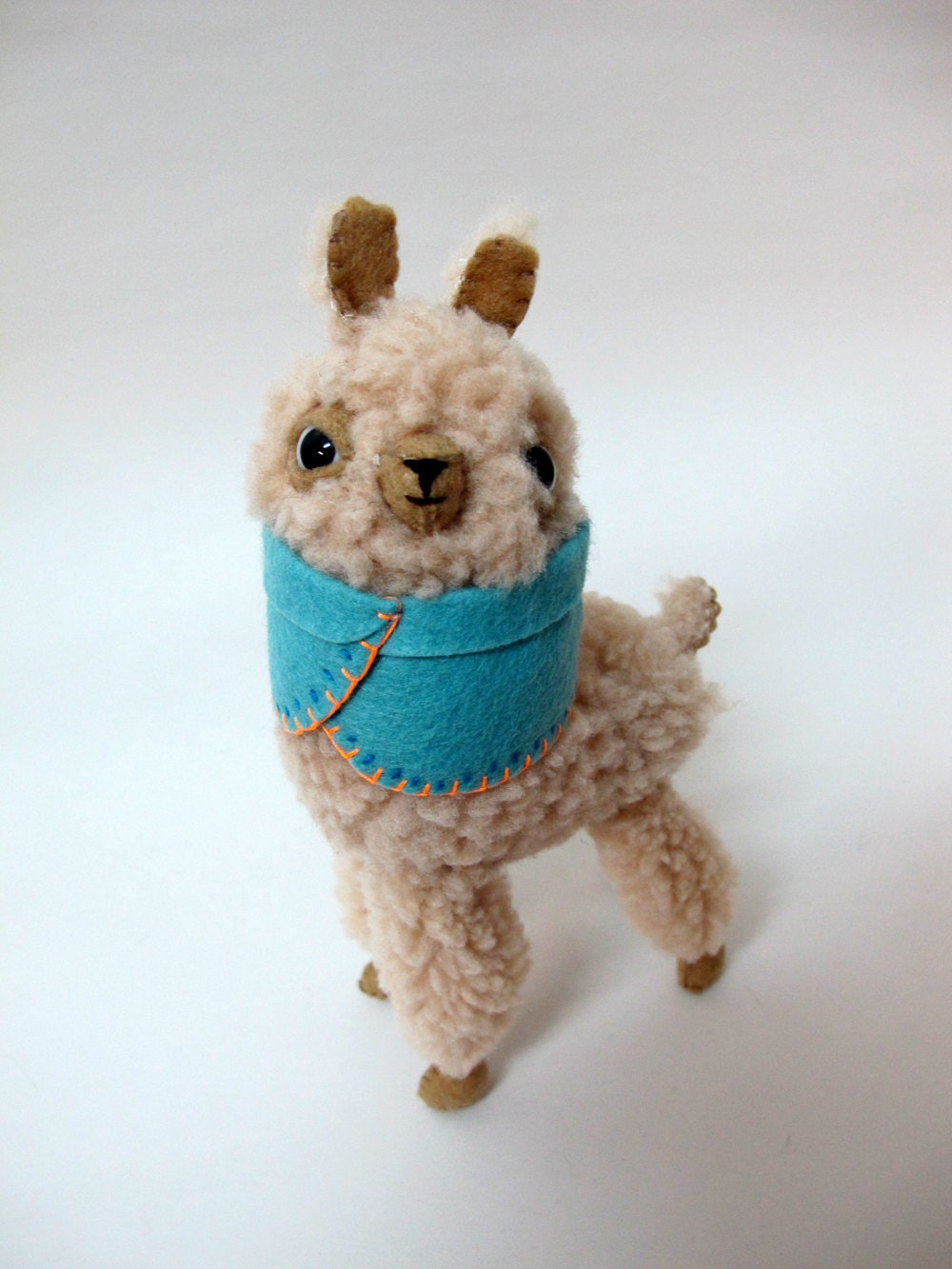Small Wooly Alpaca in a Light Blue Embroidered Cape
