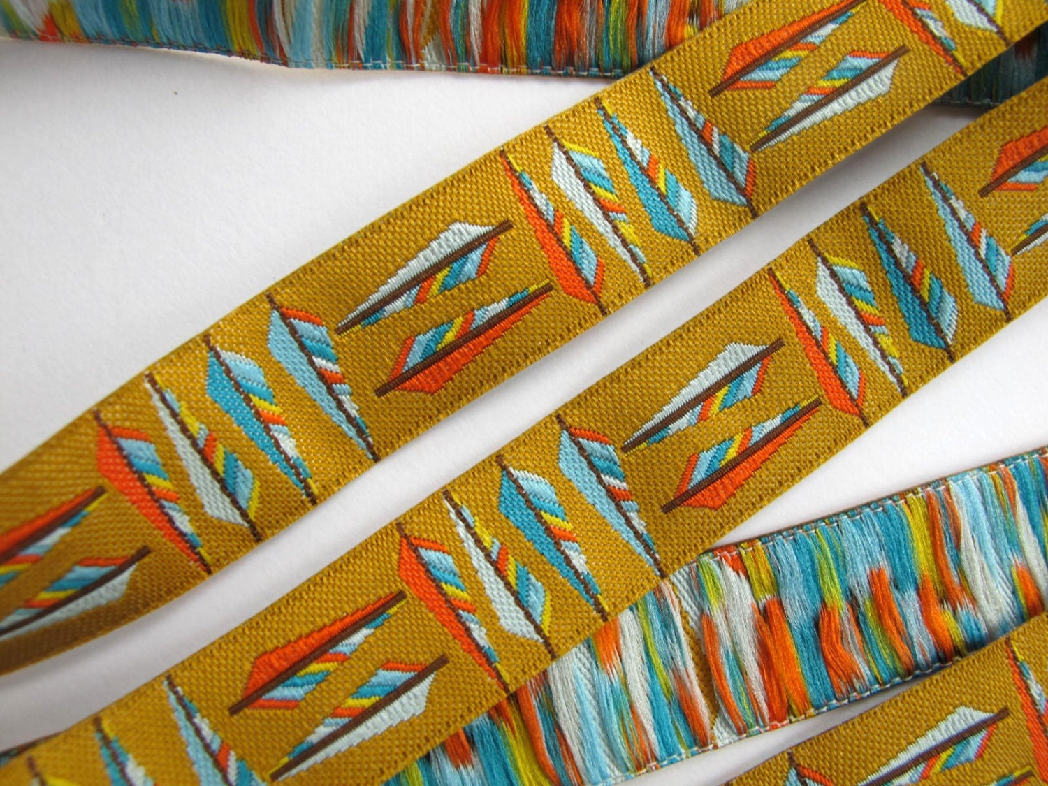 2 yards ARROW FEATHERS Jacquard trim in turquoise, orange on golden tan. 11/16 inch wide. 946-A