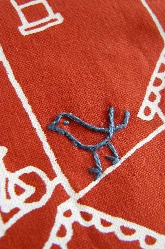 zipper pouch, purse. red bird and mouse embroidery in navy blue with white houses on cherry sustainable cotton designed fabric.