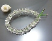 Melanie Moertel Lampwork Beads - Elastic bracelet with lots of tiny glass daisies, green and clear