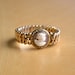 Vintage WWII expandable sweetheart bracelet, gold fiilled , repousse band and cameo