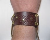 Steampunk leather bracelet / cuff with stamped gears