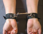 Green "Lizard skin" and black leather bondage handcuffs