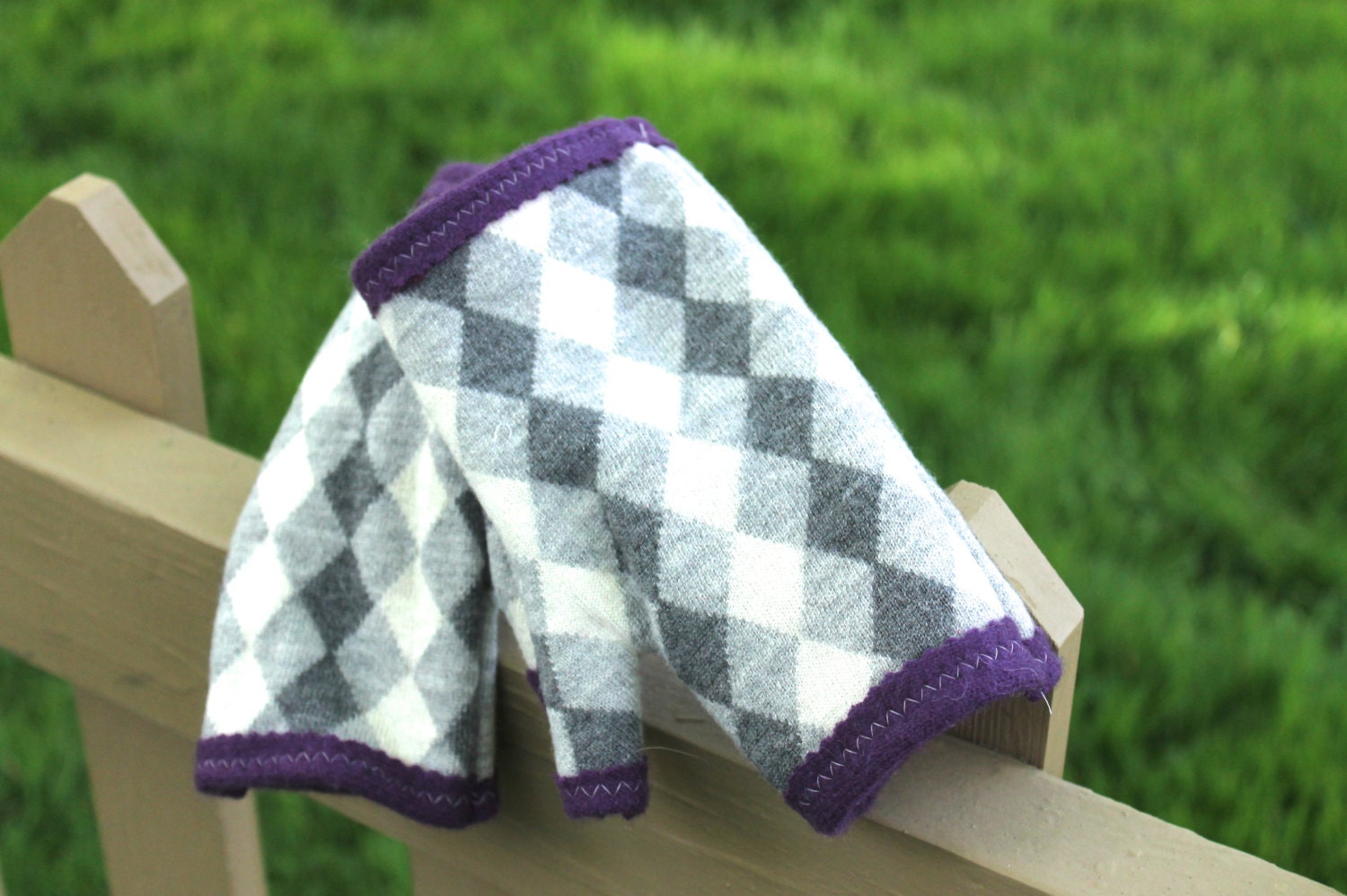 Recycled cashmere and wool fingerless gloves.  Classic argyle in grey, ivory, and charcoal.  Royal purple lining.