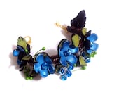 Statement bracelet with flowers. Branch bracelet. Leather jewelry