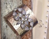 Silver textured cuff bracelet with vintage brooch