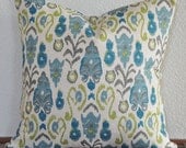 Decorative throw pillow cover in aqua, taupe and lime green on a creamy ivory background.