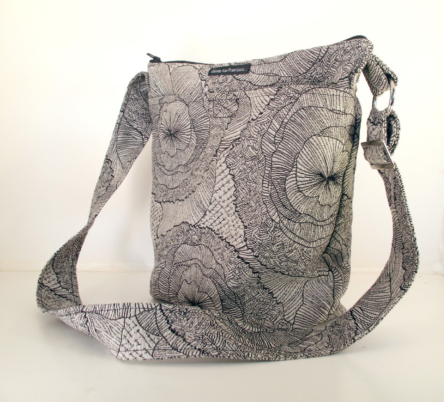 BUCKET BAG. Black and White flowers. Woman's crossbody and shoulder bag. Adjustable strap. Crossbody. Messenger. Made in USA.