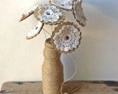 Paper flowers with vintage doilies
