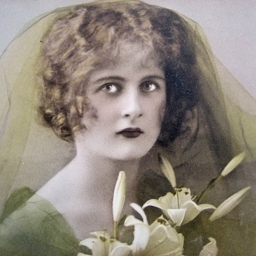 Antique French girl photo postcard, with lily flowers, 1910s