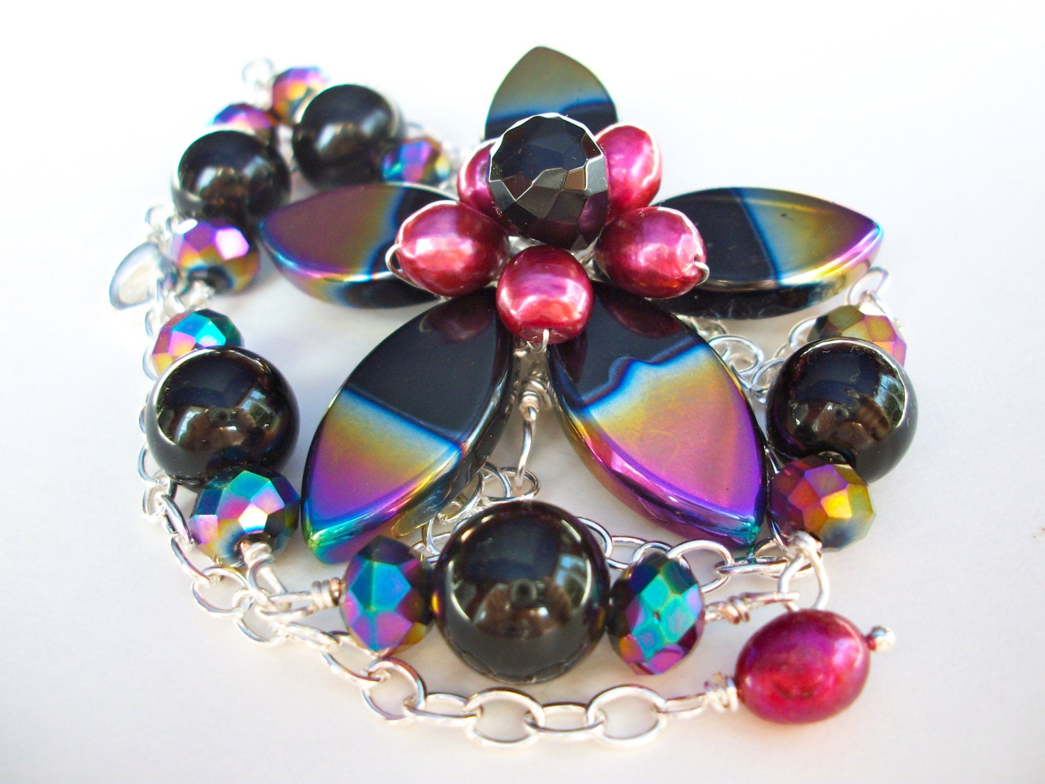Black flower necklace, asymmetrical beaded wire wrapped flower with peacock purple gold green rainbow AB finish bead flower jewelry