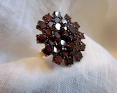 Circa 1930 Garnet Cluster ring set in 14 karat gold