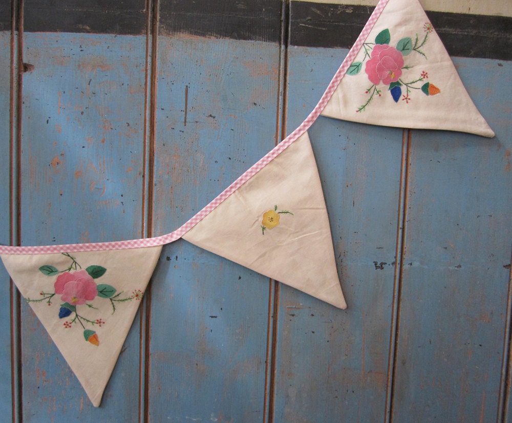 Vintage Tablecloth Bunting.  This piece has some lovely appliqued details.