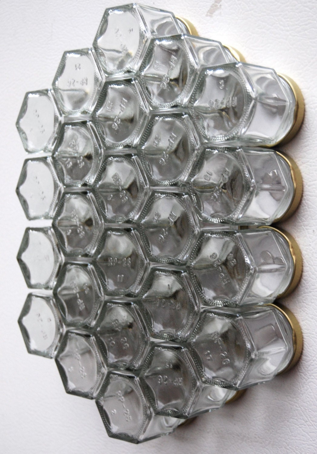 Glass Spice Jars. Customize this Magnetic Spice Rack (set of 24 empty STAMPED jars with your choice of spice names).  Free Shipping.