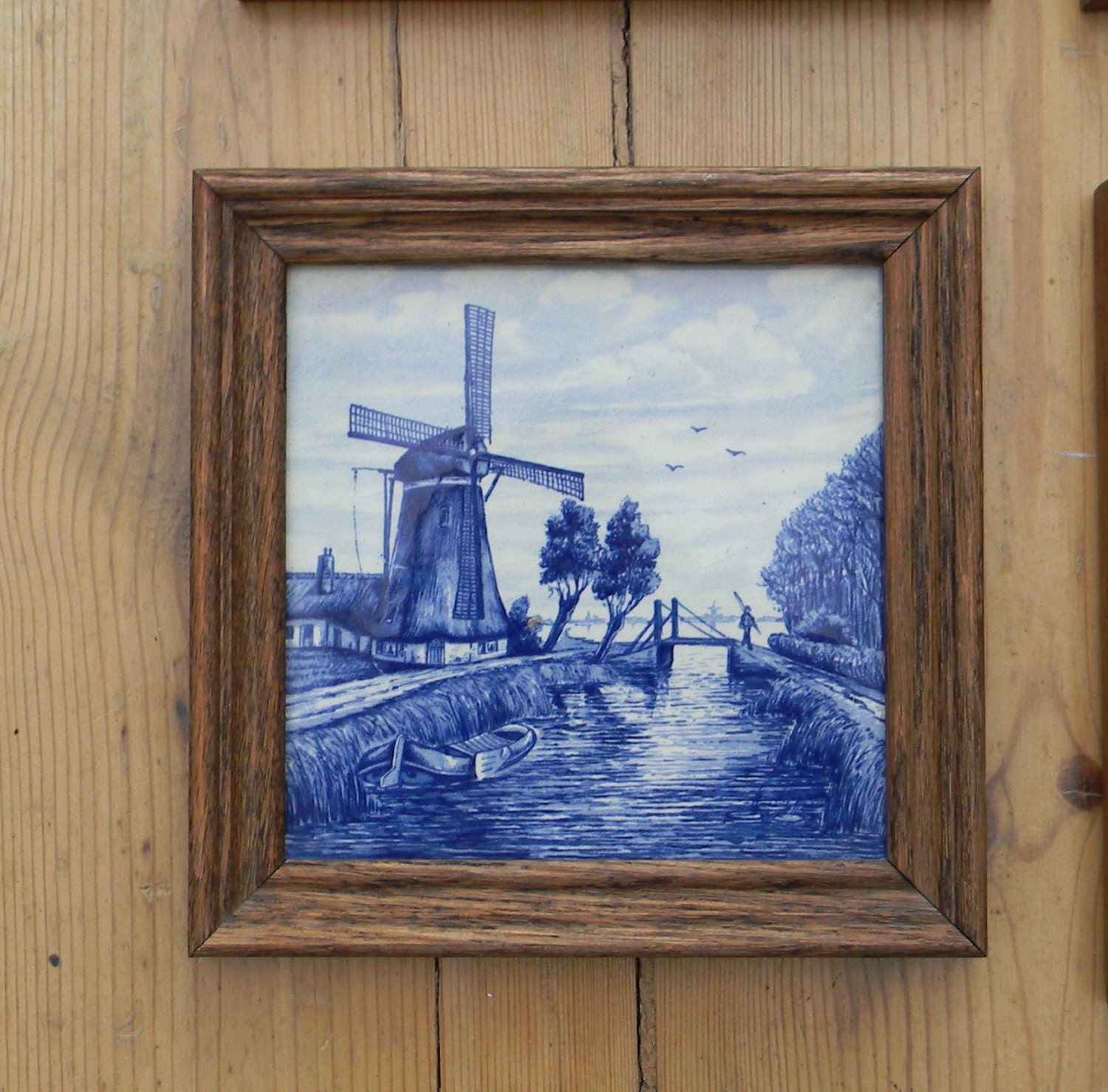 A framed  Delft blue tile made in Holland.