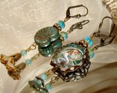 Mermaid in a shell asymmetrical earrings