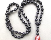 Mens black wooden beaded necklace with decorative glass bead