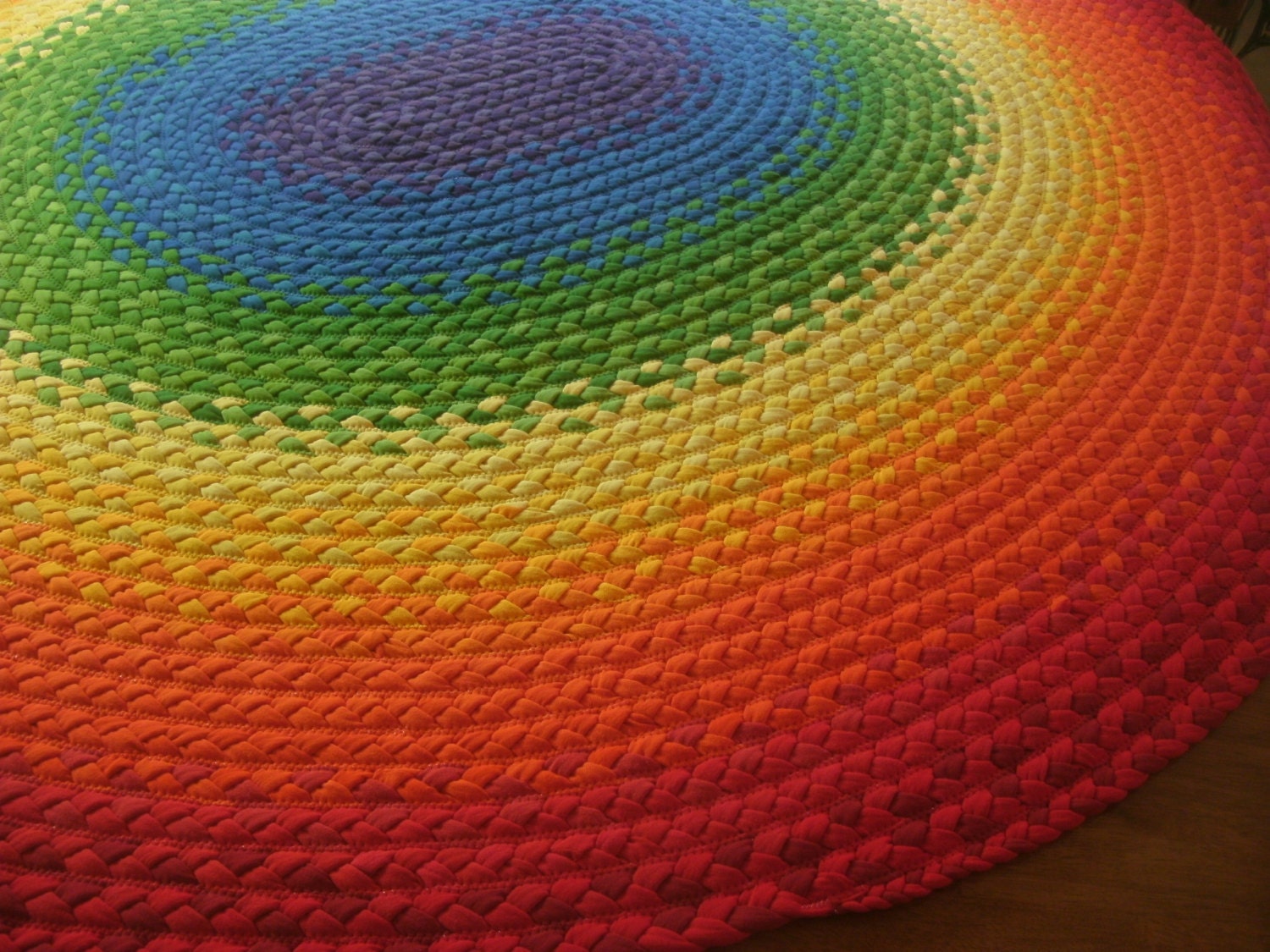 75" x 69" rainbow rug created from recycled t shirts, and organic fabric