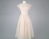 Vintage 1950s designer sheer polka dot dress with bows