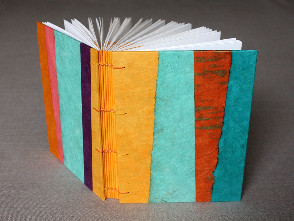 Collaged book with colorful handmade paper stripes