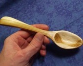 Hand carved eating spoon in natural two toned wild cherry wood