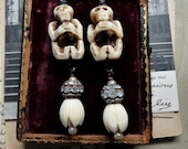 SALE:  Carved Bone Skeleton and Rose Bud Earrings, Mary Magdalene & Black Madonna Amulets, by RusticGypsyCreations