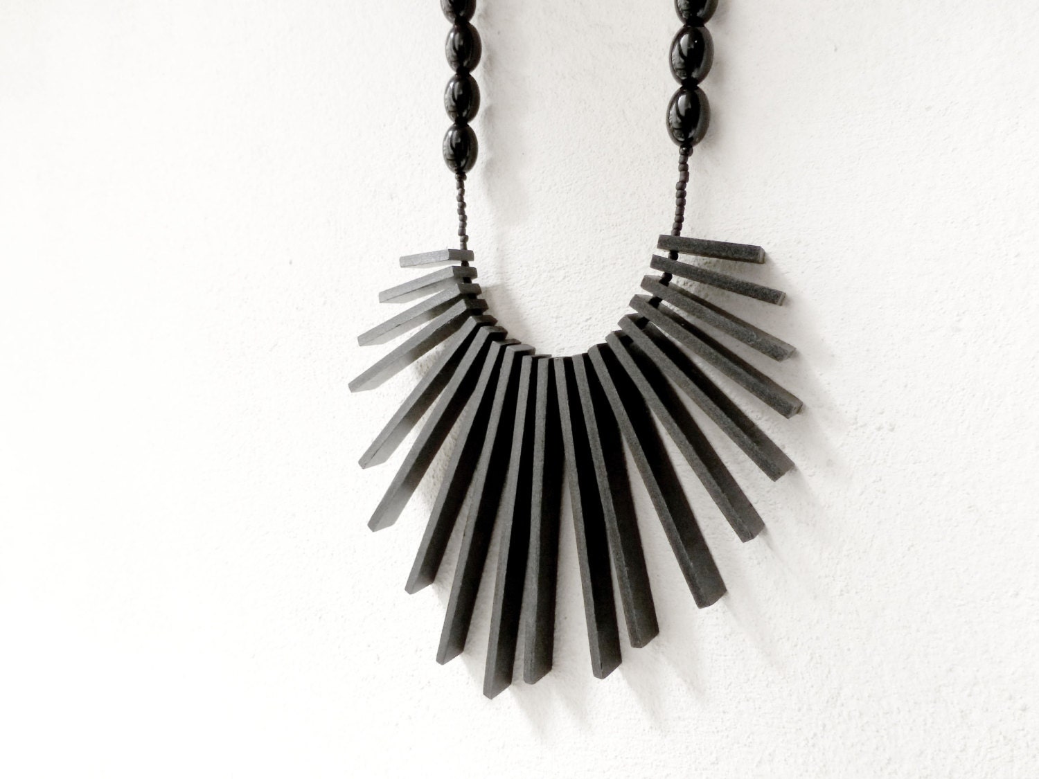 geometric tribal statement necklace with black sticks and beads - contemporary jewelry