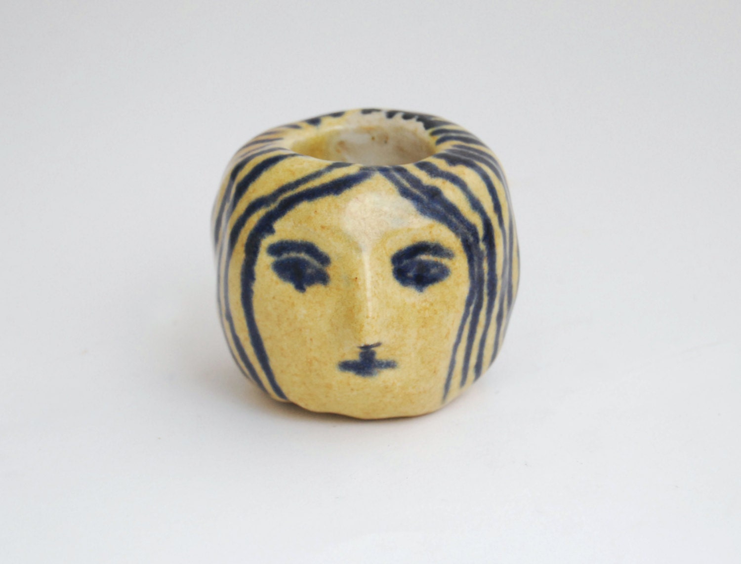 Girl's head ceramic candle holder in mustard and blue